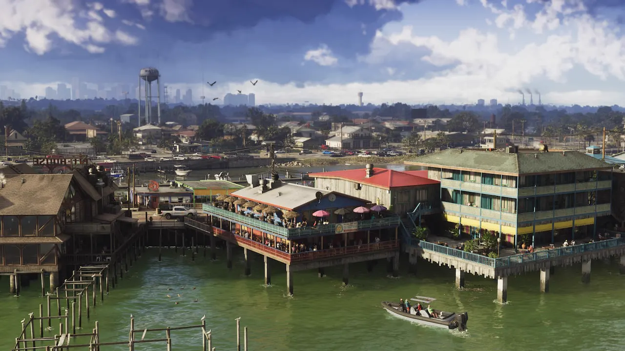 Una lancha se dirige hacia edificios sobre muelles que miran al agua. A lo lejos se ve el horizonte de Vice City.